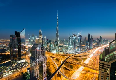 Dubai city skyline with busy roads at night