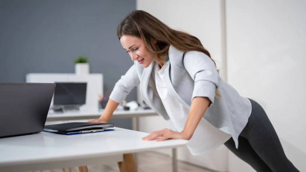 a woman doing desk excise 