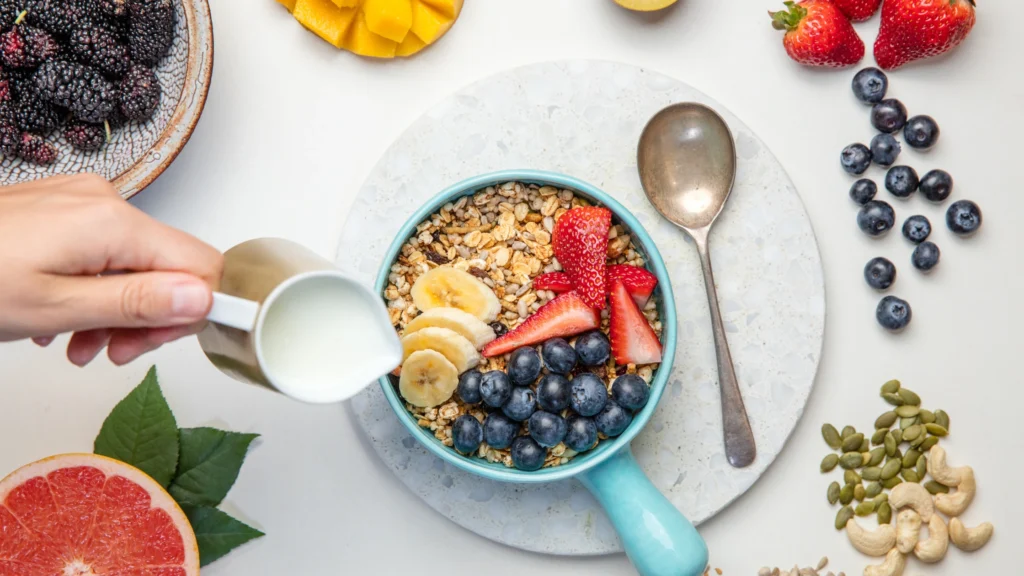 a bowl of cereal with fruit and milk