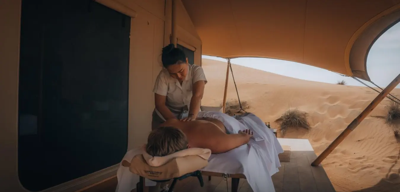 Maison Privée home massage service Dubai — therapist arriving at apartment