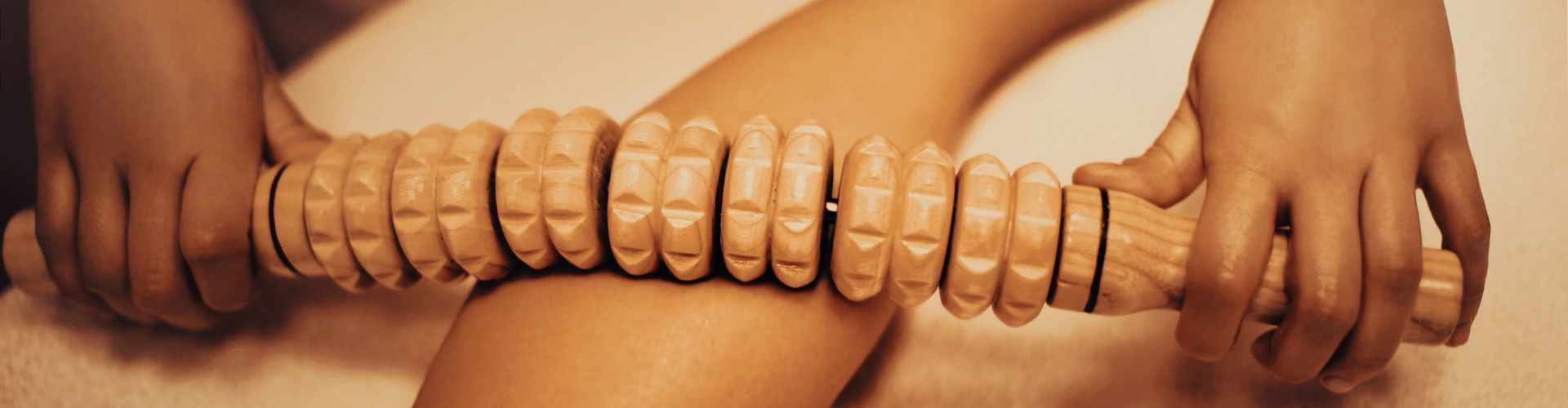 Maderotherapy body contouring session using wooden tools at home in Dubai by Maison Privée Arabia