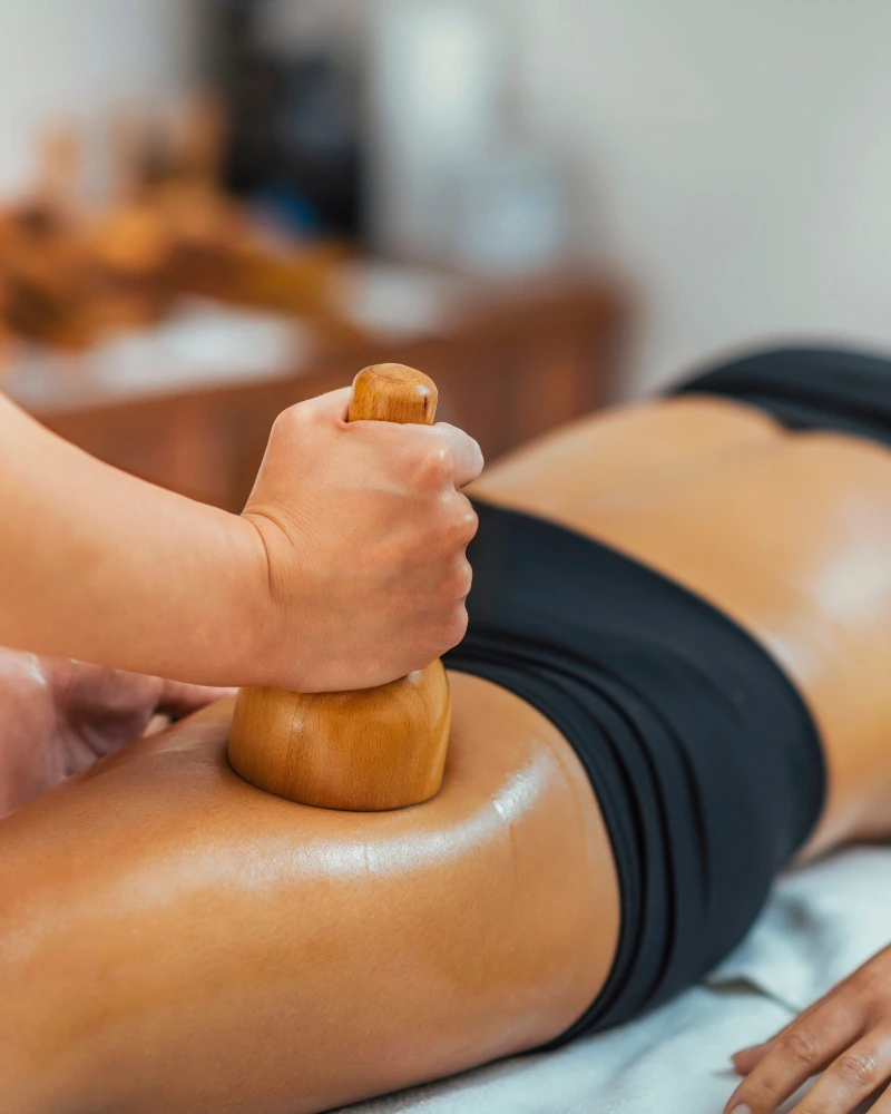 Maderotherapy wooden tools used during a wood therapy body sculpting session at home in Dubai